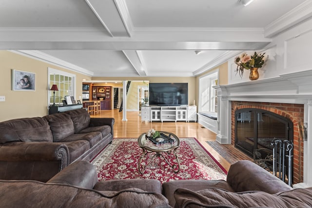 74 High St, Portland, CT 06480 - living area with beam ceiling, ornamental molding, a fireplace, and wood finished floors