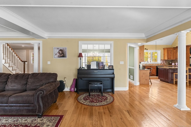 74 High St, Portland, CT 06480 - living area featuring crown molding, light wood-type flooring, and ornate columns