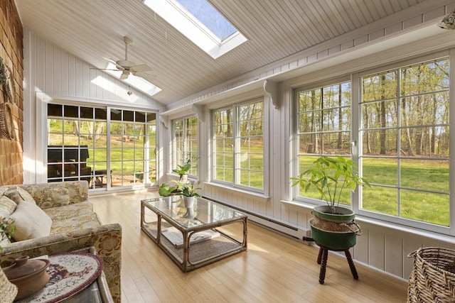 74 High St, Portland, CT 06480 - sunroom / solarium featuring vaulted ceiling with skylight, a baseboard radiator, and wood finished floors