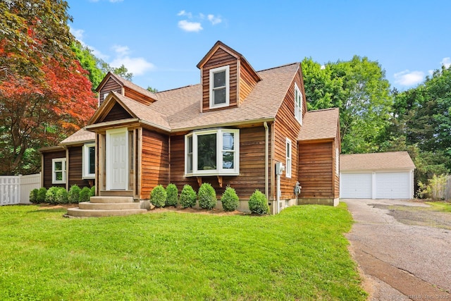 2851 Old Town Rd, Bridgeport, CT 06606 - view of front of home featuring an outbuilding, a garage, and roof with shingles