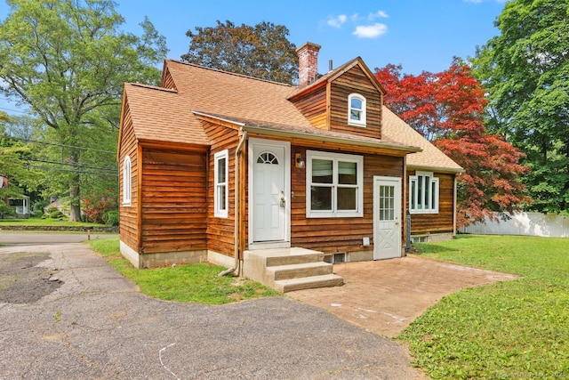 2851 Old Town Rd, Bridgeport, CT 06606 - view of front of home featuring a chimney and roof with shingles