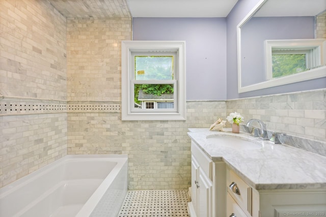 2851 Old Town Rd, Bridgeport, CT 06606 - full bath with tile walls, a tub, vanity, tile patterned floors, and wainscoting