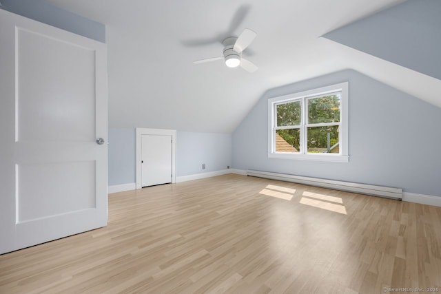 2851 Old Town Rd, Bridgeport, CT 06606 - additional living space with a baseboard radiator, wood finished floors, a ceiling fan, and vaulted ceiling
