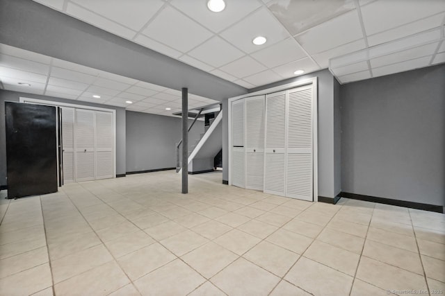 2851 Old Town Rd, Bridgeport, CT 06606 - finished below grade area with a paneled ceiling, recessed lighting, stairs, and light tile patterned floors