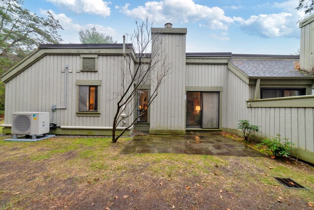669 Heritage Vlg Unit B, Southbury, CT 06488 - back of house with a patio, ac unit, and a chimney