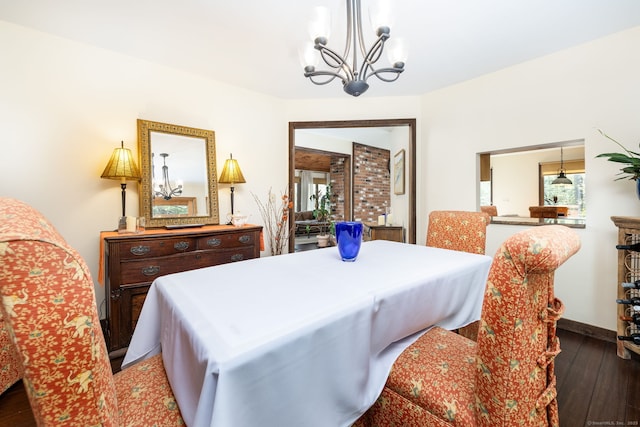 dining space featuring a notable chandelier and hardwood / wood-style flooring