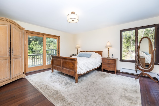 bedroom featuring access to outside, dark wood finished floors, and baseboard heating
