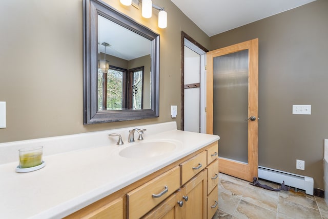 bathroom featuring vanity and a baseboard heating unit