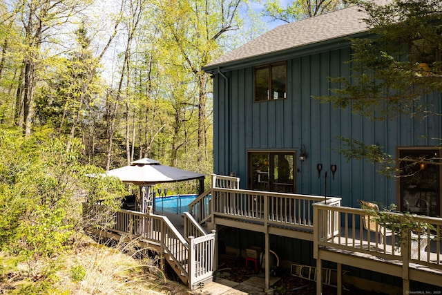 deck with an outdoor pool and stairs