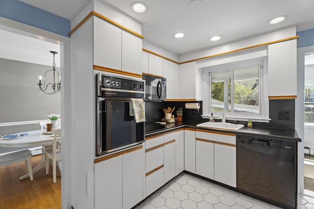 131 Vesper St, Fairfield, CT 06825 - kitchen with dark countertops, a sink, a chandelier, white cabinetry, and black appliances