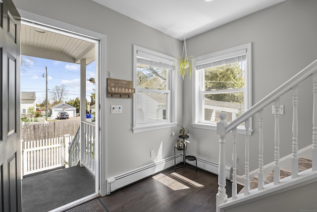 131 Vesper St, Fairfield, CT 06825 - entryway with stairs, a baseboard heating unit, and dark wood-style floors