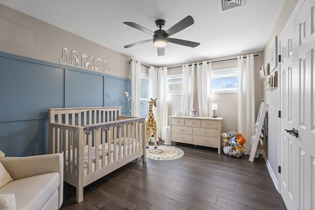 131 Vesper St, Fairfield, CT 06825 - bedroom with dark wood-style floors, multiple windows, a crib, and visible vents