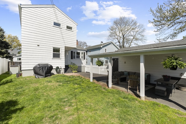 131 Vesper St, Fairfield, CT 06825 - rear view of house featuring a patio area, outdoor lounge area, fence, and a lawn
