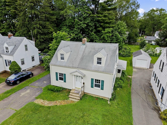 240 Barbara Rd, Middletown, CT 06457 - cape cod-style house with a front yard, a chimney, a detached garage, and an outbuilding