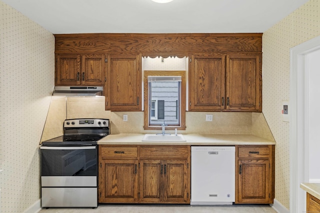 240 Barbara Rd, Middletown, CT 06457 - kitchen with white dishwasher, electric range, under cabinet range hood, wallpapered walls, and light countertops