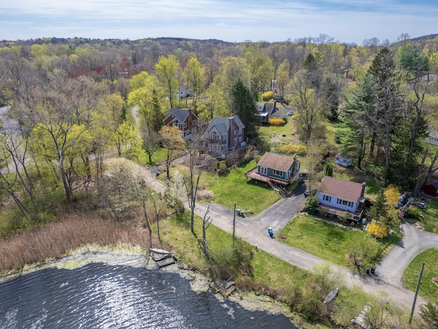 aerial view featuring a water view and a forest view