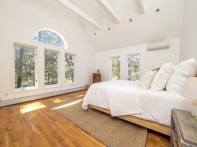 bedroom with a wall mounted air conditioner, high vaulted ceiling, baseboard heating, and multiple windows