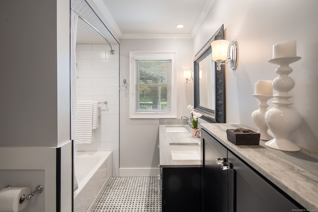full bath with a sink, tile patterned floors, crown molding, and double vanity