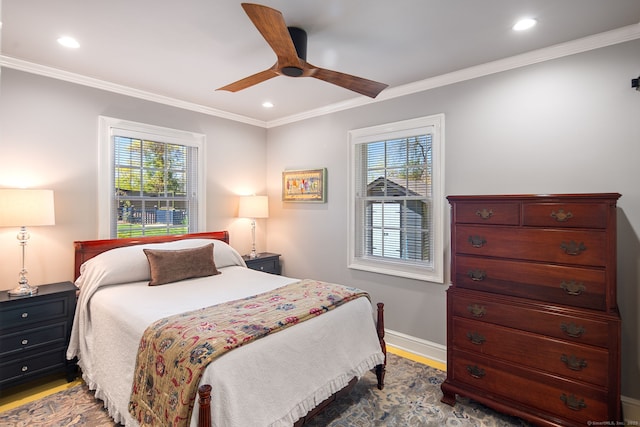 bedroom with recessed lighting, wood finished floors, and multiple windows