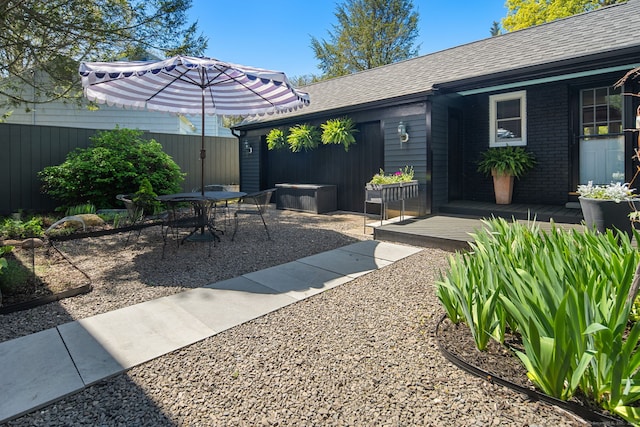 view of patio / terrace featuring fence and outdoor dining area