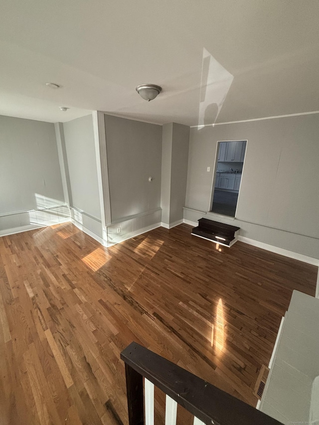 interior space featuring wood finished floors and baseboards