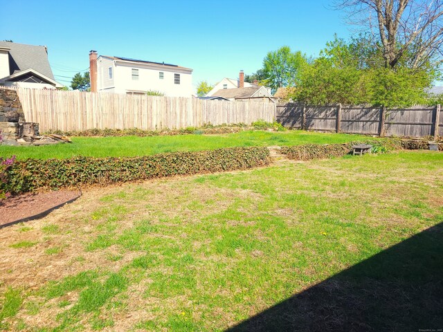 view of yard featuring a fenced backyard