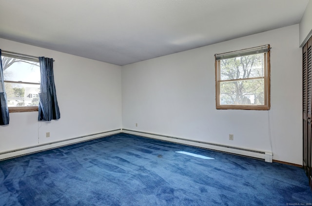 carpeted spare room with baseboards