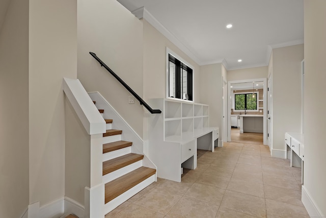 317 Park St, New Canaan, CT 06840 - staircase with ornamental molding, recessed lighting, and tile patterned floors