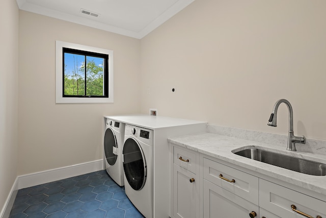 317 Park St, New Canaan, CT 06840 - laundry room featuring cabinet space, separate washer and dryer, dark tile patterned flooring, and ornamental molding