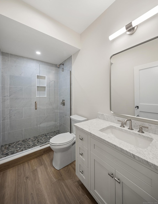 317 Park St, New Canaan, CT 06840 - full bathroom featuring vanity, a stall shower, and wood finished floors