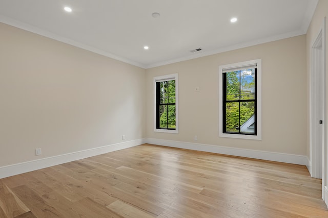 317 Park St, New Canaan, CT 06840 - empty room with ornamental molding, light wood finished floors, and recessed lighting