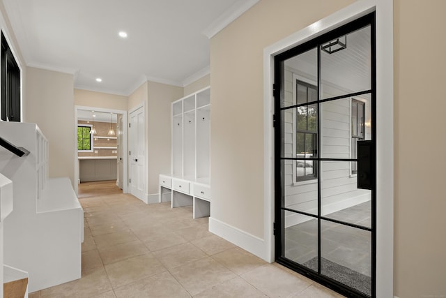 317 Park St, New Canaan, CT 06840 - mudroom featuring ornamental molding, light tile patterned floors, and recessed lighting