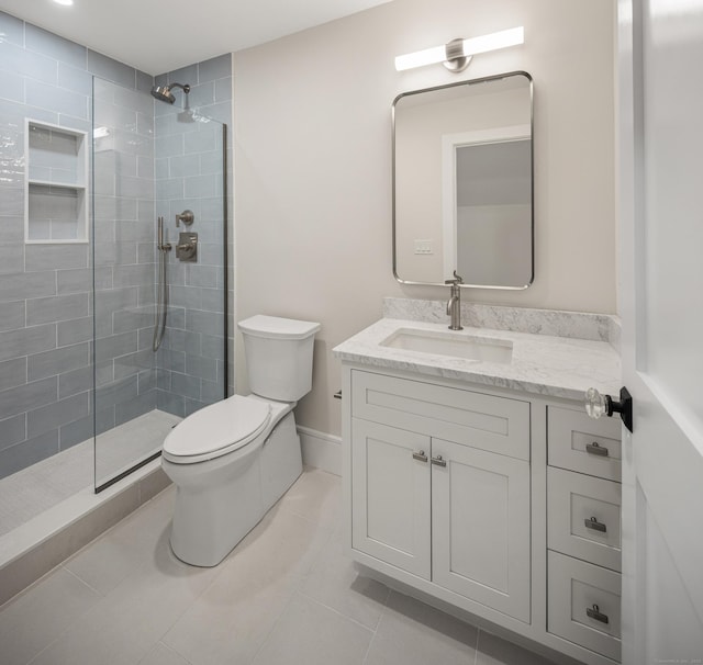 317 Park St, New Canaan, CT 06840 - full bathroom with vanity, a tile shower, and tile patterned floors