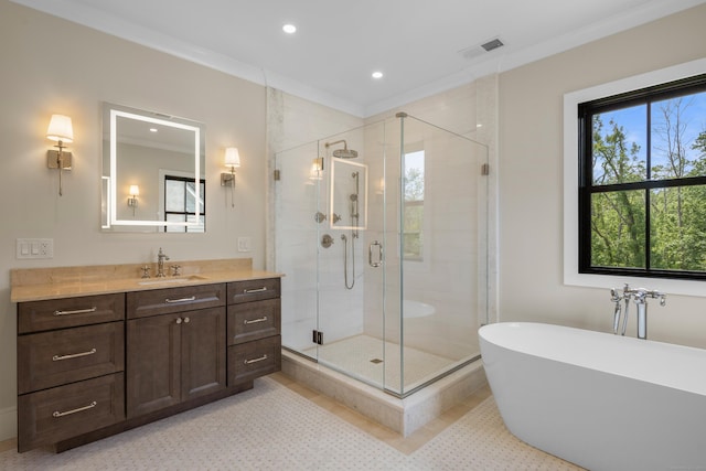 317 Park St, New Canaan, CT 06840 - full bathroom with vanity, a freestanding tub, a stall shower, recessed lighting, and ornamental molding