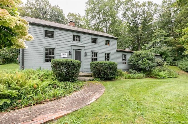 112 Easton Rd, Westport, CT 06880 - view of front facade with a front yard and a chimney