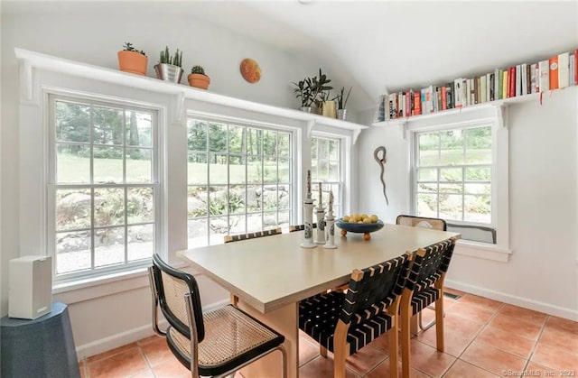112 Easton Rd, Westport, CT 06880 - dining room featuring light tile patterned floors and vaulted ceiling
