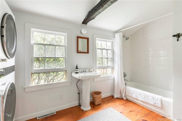 112 Easton Rd, Westport, CT 06880 - full bath with healthy amount of natural light, wood finished floors, shower / bath combination with curtain, and lofted ceiling