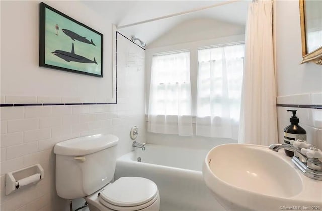 112 Easton Rd, Westport, CT 06880 - full bath featuring tile walls, vaulted ceiling, tub / shower combination, and a wainscoted wall