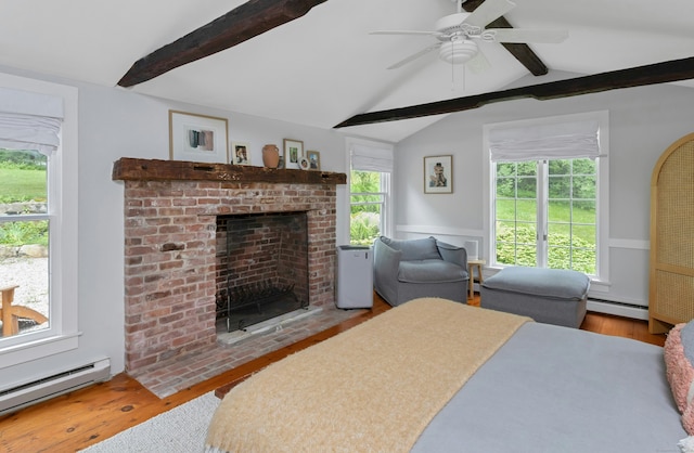 112 Easton Rd, Westport, CT 06880 - bedroom with a baseboard radiator, a fireplace, wood finished floors, and a wainscoted wall