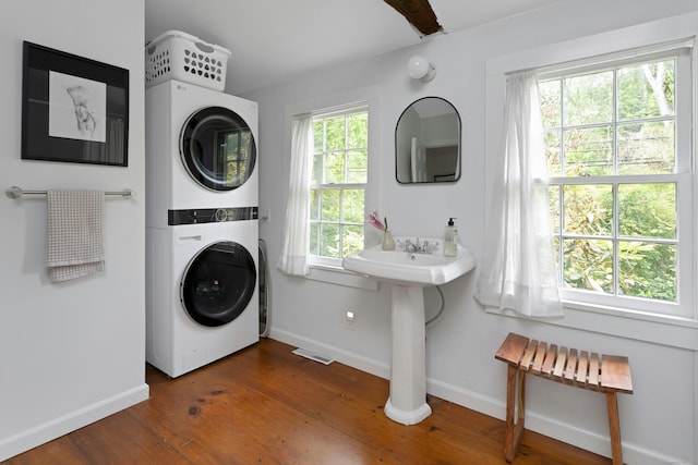 112 Easton Rd, Westport, CT 06880 - laundry room featuring stacked washing machine and dryer and wood finished floors