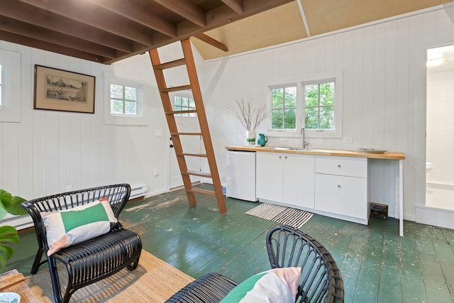 112 Easton Rd, Westport, CT 06880 - living area with dark wood-type flooring and wood walls