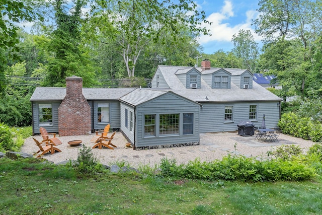 112 Easton Rd, Westport, CT 06880 - back of house with an outdoor fire pit, a chimney, and a patio