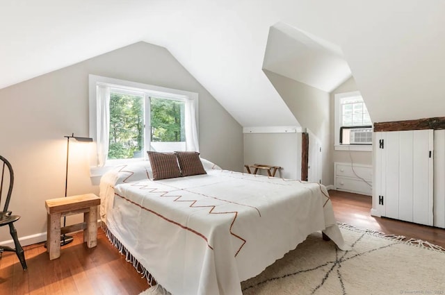 112 Easton Rd, Westport, CT 06880 - bedroom with wood finished floors, multiple windows, cooling unit, and vaulted ceiling