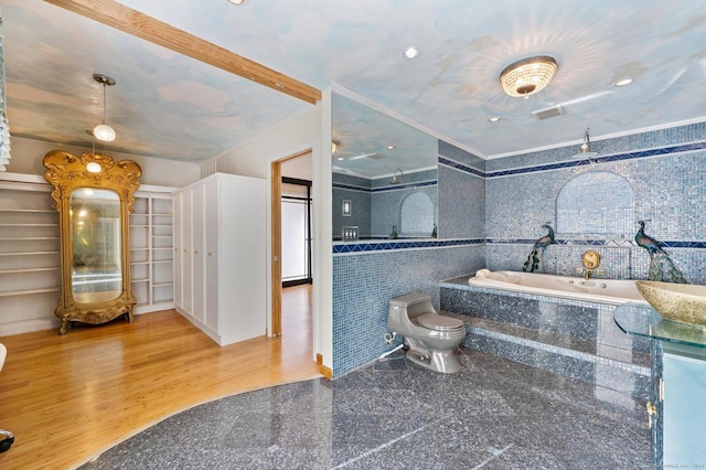 bathroom with a garden tub, toilet, and visible vents