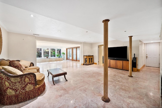 living room featuring ornate columns and recessed lighting