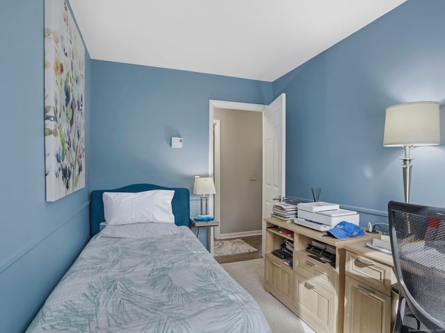 bedroom with light colored carpet