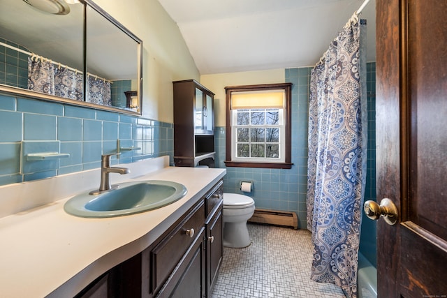 bathroom featuring tile walls, vanity, a baseboard radiator, tile patterned floors, and toilet