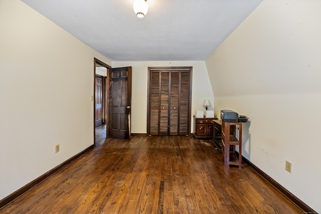 office space featuring baseboards and hardwood / wood-style flooring