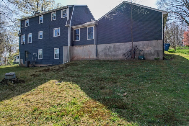 view of side of home featuring a lawn