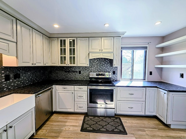 664C Heritage Vlg, Southbury, CT 06488 - kitchen with appliances with stainless steel finishes, open shelves, light wood finished floors, tasteful backsplash, and recessed lighting